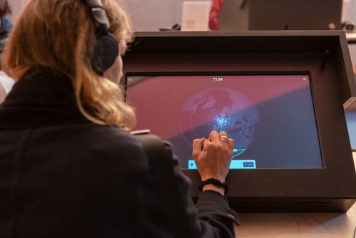 A user tries out the Transcultural Listening Map on a touchscreen