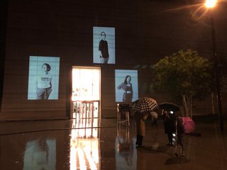Portrait of Tina Meinhardt, along with two other portraits from Larissa Barth’s walter ≠ bauhaus series, projected onto the façade of the Bauhaus Museum Weimar.